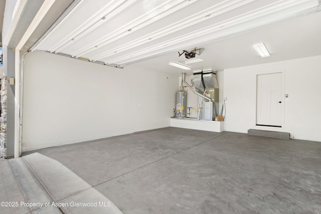 1652 E 17th Cir, Rifle, CO 81650 - garage with water heater, a garage door opener, and heating unit