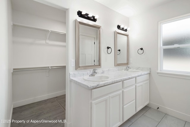 1652 E 17th Cir, Rifle, CO 81650 - bathroom featuring double vanity and a walk in closet