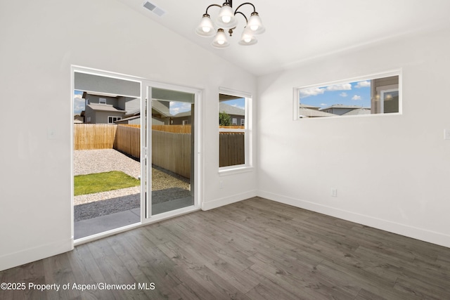 1652 E 17th Cir, Rifle, CO 81650 - unfurnished dining area with a chandelier, wood finished floors, and vaulted ceiling