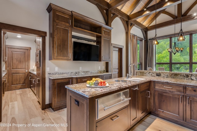 900 Dorais Way, Redstone, CO 81623 - kitchen with a warming drawer, a sink, light wood-style flooring, decorative light fixtures, and wood ceiling with exposed beams