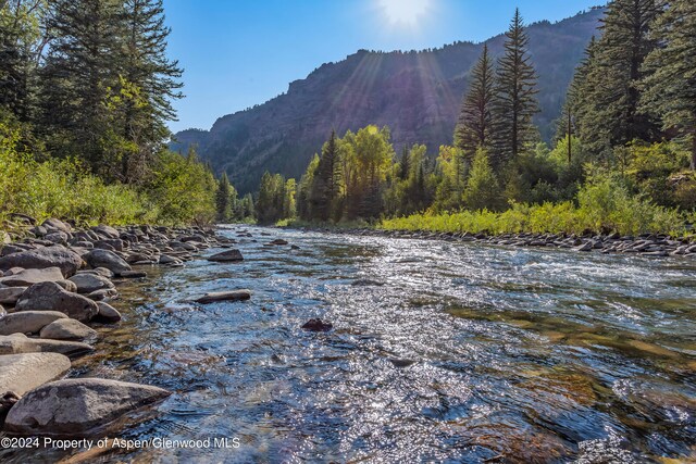 900 Dorais Way, Redstone, CO 81623 - water view with a heavily wooded area and mountains