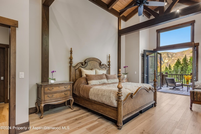 900 Dorais Way, Redstone, CO 81623 - bedroom with high vaulted ceiling, access to exterior, light wood finished floors, wood ceiling with exposed beams, and ceiling fan