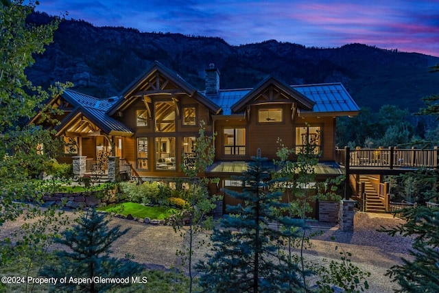 900 Dorais Way, Redstone, CO 81623 - back of property featuring a standing seam roof, stairs, metal roof, a chimney, and a deck with mountain view