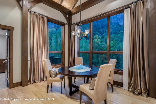 900 Dorais Way, Redstone, CO 81623 - dining space featuring light wood-style flooring, a chandelier, and baseboards
