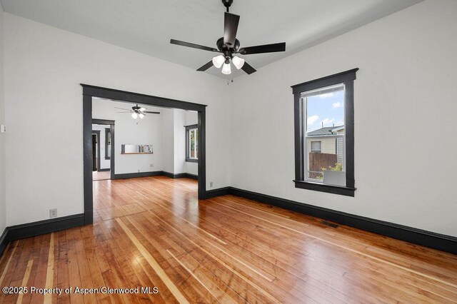580 Curtis Ave, De Beque, CO 81630 - empty room featuring hardwood / wood-style flooring, ceiling fan, and baseboards