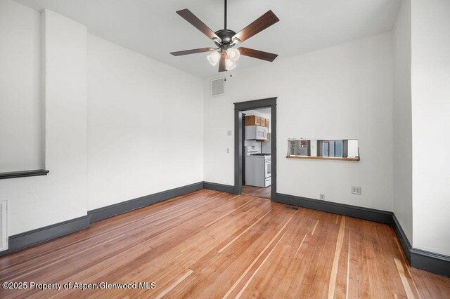 580 Curtis Ave, De Beque, CO 81630 - spare room featuring ceiling fan, hardwood / wood-style flooring, and baseboards