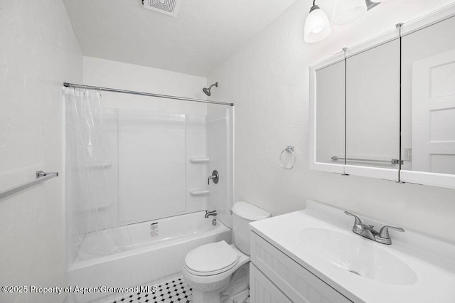 bathroom with toilet, vanity, and shower / bath combo with shower curtain
