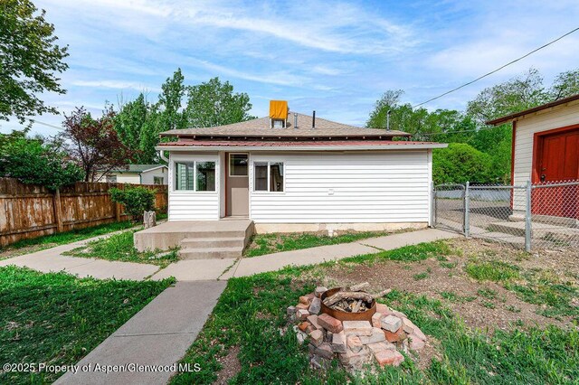 580 Curtis Ave, De Beque, CO 81630 - view of front of home featuring an outdoor fire pit and a fenced backyard