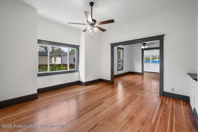 580 Curtis Ave, De Beque, CO 81630 - spare room featuring plenty of natural light, a ceiling fan, and hardwood / wood-style flooring