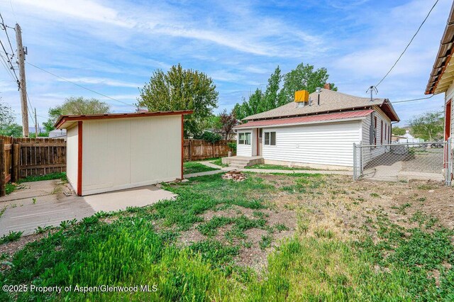 580 Curtis Ave, De Beque, CO 81630 - view of yard with an outbuilding and a storage unit