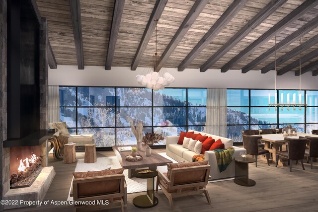 living room featuring a mountain view, wood-type flooring, lofted ceiling with beams, and wood ceiling