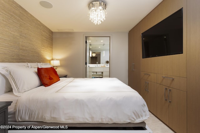 bedroom featuring an inviting chandelier