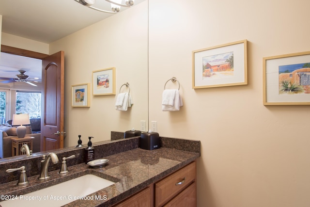 bathroom with ceiling fan and vanity