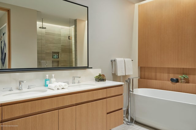 bathroom featuring vanity and shower with separate bathtub