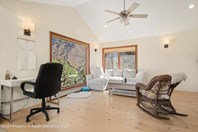 office space featuring ceiling fan, light hardwood / wood-style floors, and high vaulted ceiling