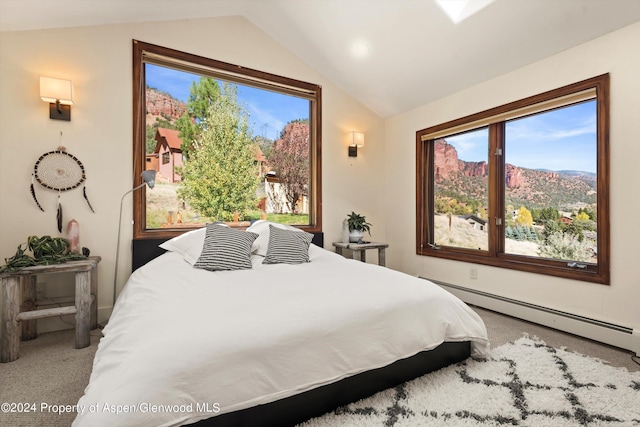 carpeted bedroom with a mountain view, a baseboard heating unit, multiple windows, and lofted ceiling