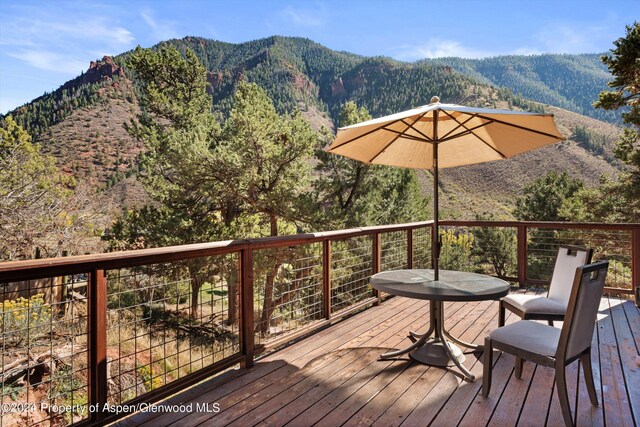 wooden terrace featuring a mountain view