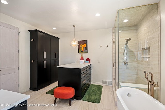 bathroom featuring vanity, wood-type flooring, and plus walk in shower