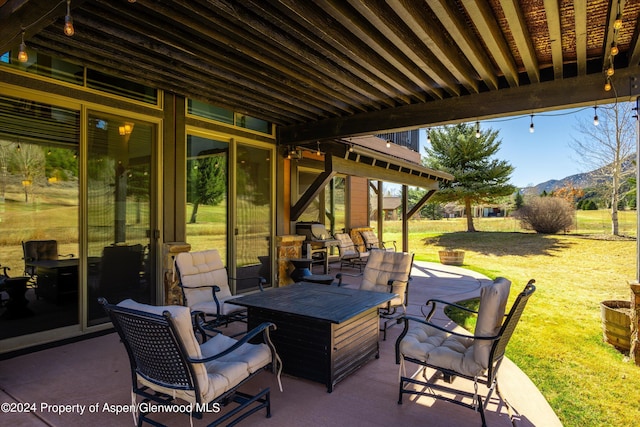 view of patio / terrace with a mountain view and an outdoor living space