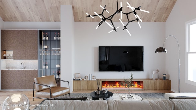 living room featuring hardwood / wood-style floors, plenty of natural light, wood ceiling, and sink