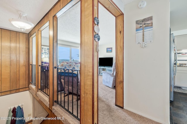2201/2203 B St, Craig, CO 81625 - corridor featuring a textured ceiling and carpet flooring