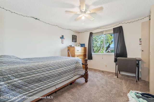 2201/2203 B St, Craig, CO 81625 - carpeted bedroom featuring a textured ceiling and ceiling fan