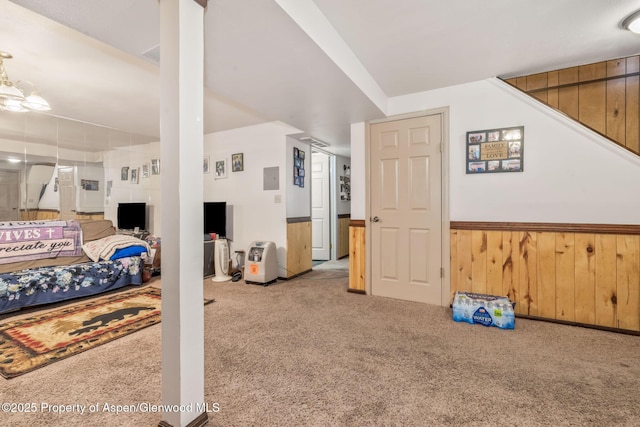 2201/2203 B St, Craig, CO 81625 - bedroom featuring carpet, a wainscoted wall, and wooden walls