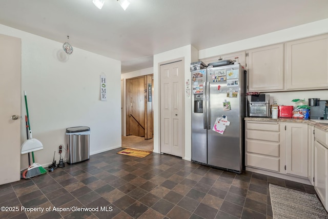 2201/2203 B St, Craig, CO 81625 - kitchen with stainless steel fridge with ice dispenser and baseboards