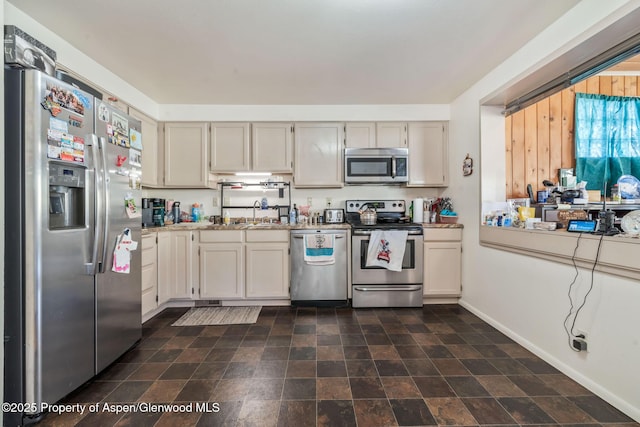 2201/2203 B St, Craig, CO 81625 - kitchen featuring appliances with stainless steel finishes, light countertops, and stone finish flooring