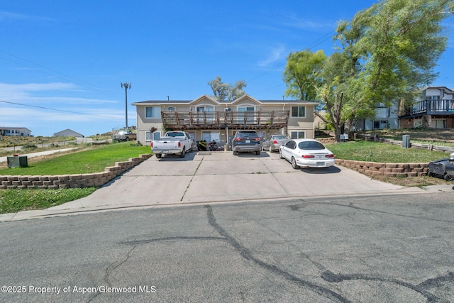 2201/2203 B St, Craig, CO 81625 - view of front facade featuring a front yard and a balcony