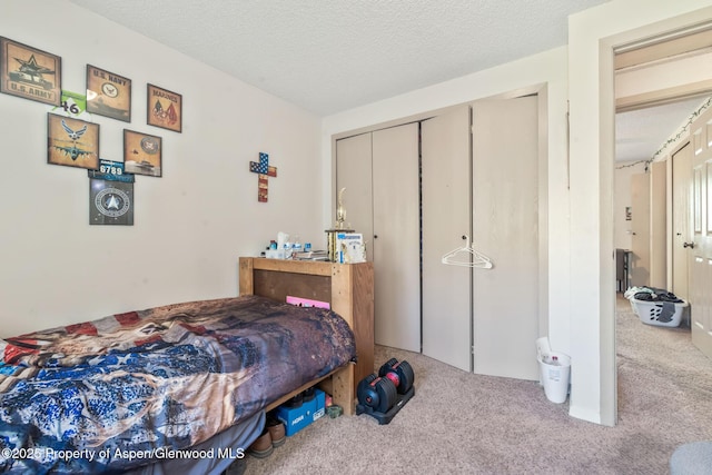 2201/2203 B St, Craig, CO 81625 - carpeted bedroom featuring a closet and a textured ceiling