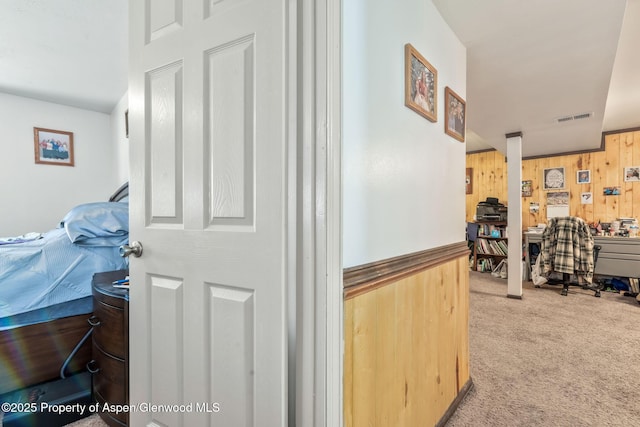 2201/2203 B St, Craig, CO 81625 - hall with wood walls and carpet flooring