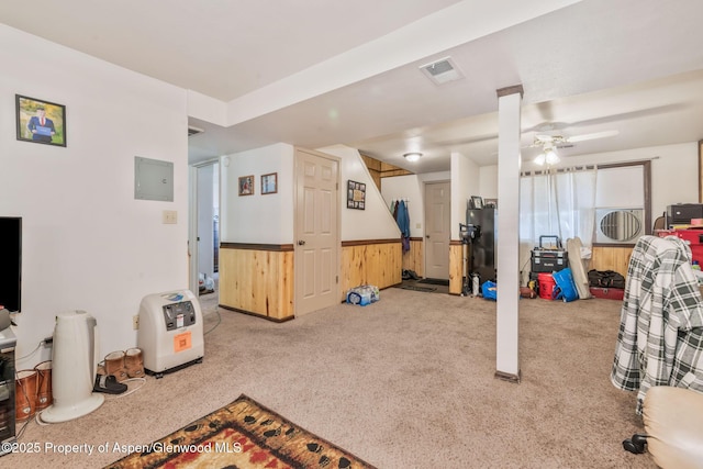 2201/2203 B St, Craig, CO 81625 - basement with a ceiling fan, a wainscoted wall, wooden walls, carpet flooring, and electric panel