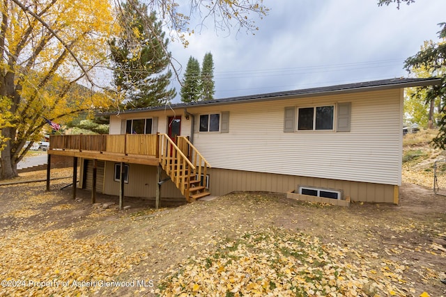 rear view of property with a deck