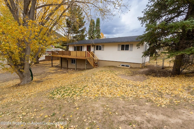 rear view of property with a deck