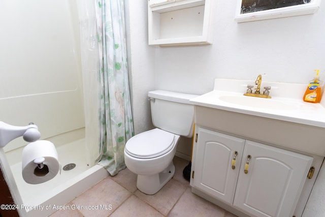 bathroom featuring a shower with curtain, toilet, and vanity