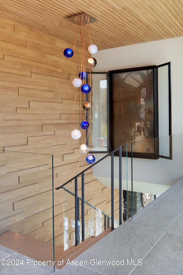 stairway with wood ceiling