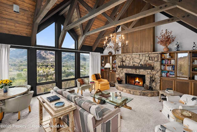 162 Bennett Bench Rd, Aspen, CO 81611 - living room with carpet floors, high vaulted ceiling, a wooden ceiling with exposed beams, a chandelier, and a stone fireplace