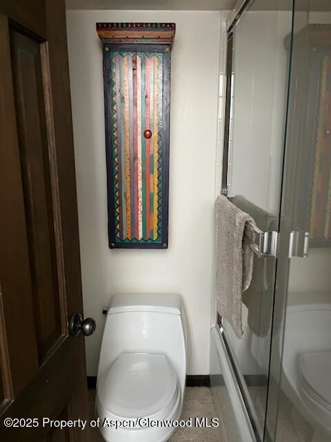162 Bennett Bench Rd, Aspen, CO 81611 - bathroom featuring toilet and combined bath / shower with glass door