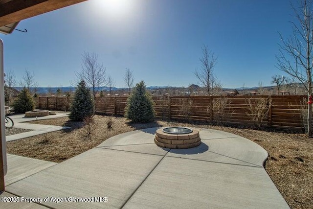 view of patio / terrace with a fire pit