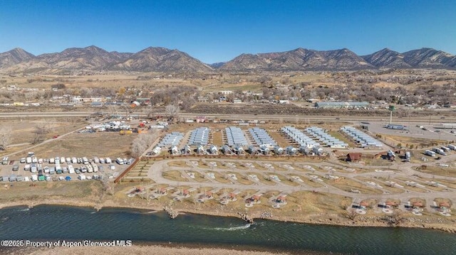 bird's eye view with a water and mountain view