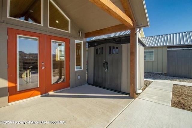 view of exterior entry featuring french doors