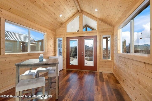 sunroom featuring vaulted ceiling with beams, wood ceiling, and french doors