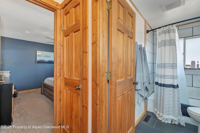 1186 Washington St, Craig, CO 81625 - bathroom with shower / bath combo with shower curtain and tile patterned floors