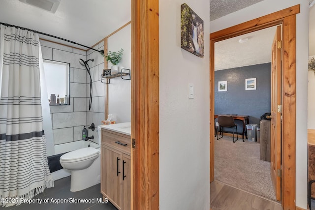 1186 Washington St, Craig, CO 81625 - bathroom featuring vanity, shower / bath combo, and wood finished floors