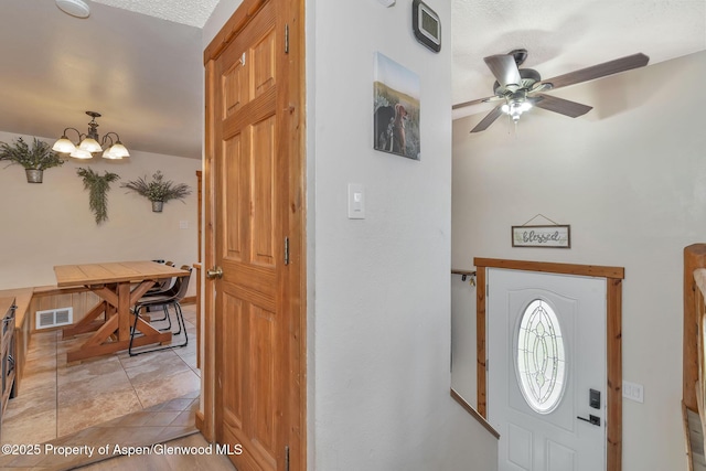 1186 Washington St, Craig, CO 81625 - foyer entrance featuring a ceiling fan and a chandelier