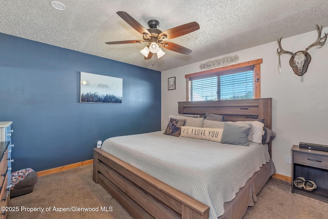 1186 Washington St, Craig, CO 81625 - carpeted bedroom featuring a textured ceiling and a ceiling fan