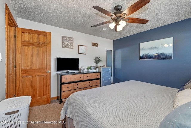 1186 Washington St, Craig, CO 81625 - bedroom featuring light colored carpet, a textured ceiling, and ceiling fan