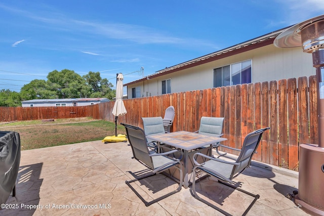 1186 Washington St, Craig, CO 81625 - fenced backyard featuring outdoor dining space and a patio area