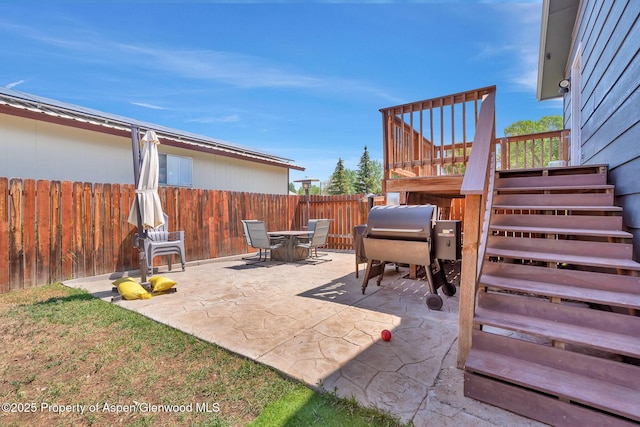 1186 Washington St, Craig, CO 81625 - view of patio with outdoor dining space, stairs, and a grill